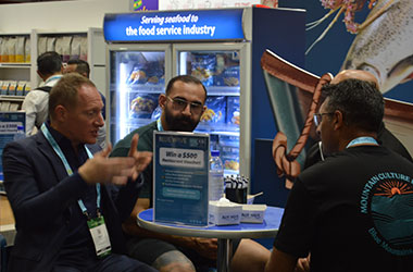 Blue Wave team speaking with foodservice professionals at Fine Food Sydney