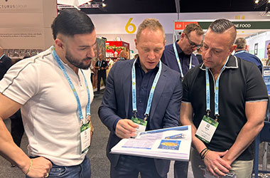 Blue Wave team speaking with foodservice professionals at Fine Food Sydney
