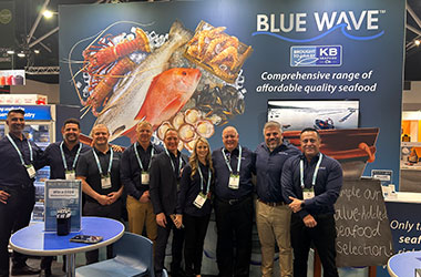 Blue Wave team standing in front of the Fine Food Sydney stand
